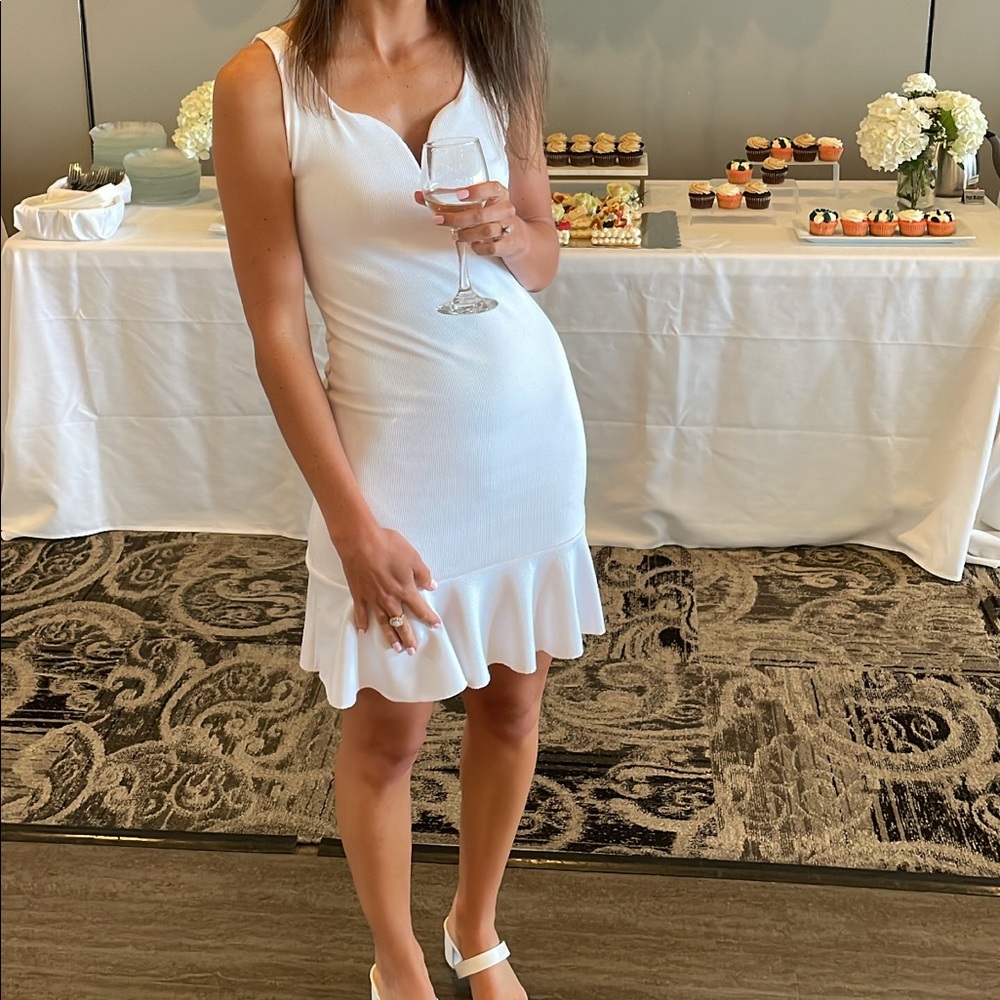 Express white ribbed mini dress with ruffle bottom
